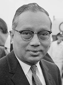 Official portrait of U Thant with a UN flag in the background.