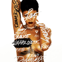 A picture of a woman with short black hair and dark lipstick, standing in front of a white back ground her nude torso is covered in graffiti-style words such as "Side Effects" in black font on her arm, the rest of words are in white/grey font "Victory", "Chalice", "Diamonds", "Navy", "7", "#R7", "Diamonds", "Happy", "Censored", "Love", "Roc", "Fun", and "Fearless" as well as "Unapologetic" covering her left side nipple, she also has very thin jewelry, a pair of small earrings and two thin chains one around her neck, the other around her nude torso, also showing her tattoo of the Egyptian goddess Isis between her cleavage.