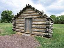 Photo shows a replica hut at Valley Forge National Park, Pennsylvania. It is located along with several other huts on North Outer Line Drive.