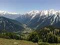 View of Aru Village enclosed by snow clad mountains from top of Birzamal.jpg