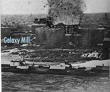 artist's rendition of the explosion on top of an old photo with the location of the Galaxy Mill marked