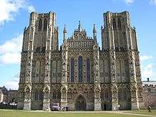 The facade of Wells, unlike Exeter, presents a unified and balanced composition. However, the towers look truncated because they were intended to have spires that were not built.