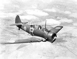 Single-engined two-seat military monoplane in flight, three-quarters overhead