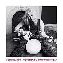 A black-and-white image of a woman sitting with a guitar. It is surrounded by a white border. Red block text below reads "Courtney Love You Know My Name/Wedding Day".