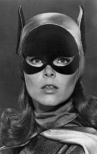 Headshot of a young woman in a Batman type cowl